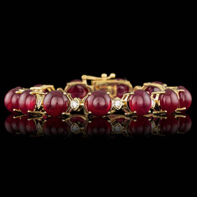 14k Gold 64.00ct Ruby 0.95ct Diamond Bracelet: Retail: $29,600.00 ****** 14k Gold 64.00ct Ruby 0.95ct Diamond Bracelet ****** Metal: 14k Solid Yellow Gold / Size: 7 / Total Item Weight: 29.0 grams / Country Made: United States / / Main Stone: Ruby