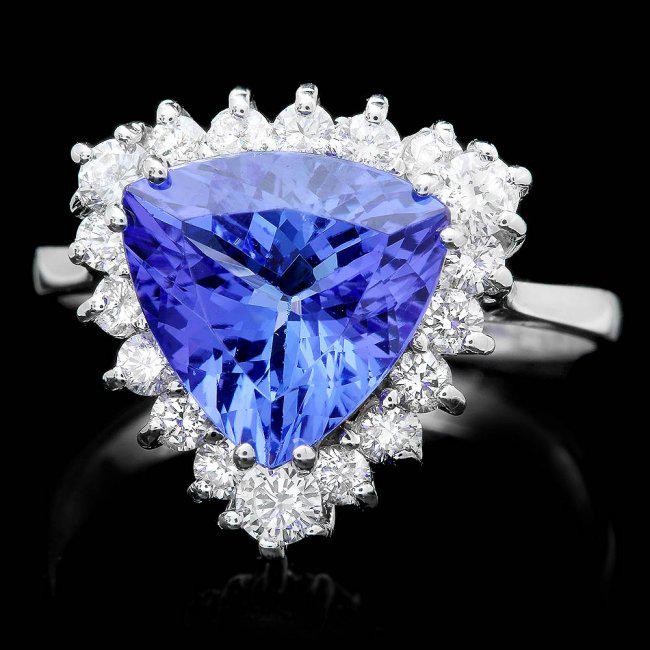 14k Gold 3.00ct Tanzanite 0.70ct Diamond Ring: Retail: $9,850.00 ****** 14k Gold 3.00ct Tanzanite 0.70ct Diamond Ring ****** Metal: 14k Solid White Gold / Size: 7.25 / Total Item Weight: 4.5 grams / Country Made: United States / / Main Stone: Tanz