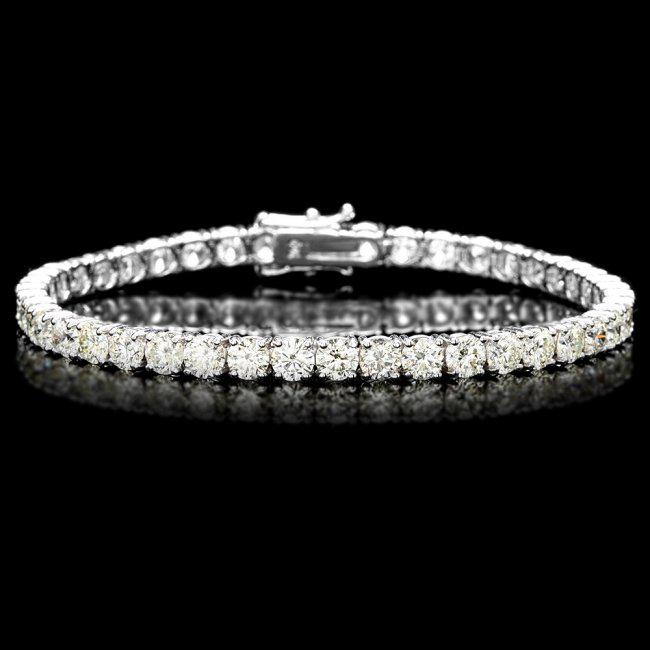 18k White Gold 12.00ct Diamond Tennis Bracelet: Retail: $49,600.00 ****** 18k White Gold 12.00ct Diamond Tennis Bracelet ****** Metal: 18k Solid White Gold / Size: 7.5 / Total Item Weight: 14.0 grams / Country Made: United States / / Main Stone: Di
