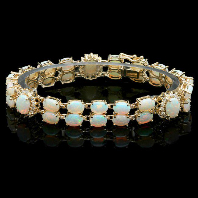 14k Yellow Gold 18ct Opal 1.10ct Diamond Bracelet: Retail: $18,700.00 ****** 14k Yellow Gold 18ct Opal 1.10ct Diamond Bracelet ****** Metal: 14k Solid Yellow Gold / Size: 7.5 / Total Item Weight: 22.5 grams / Country Made: United States / / Main Stone