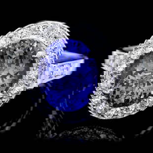 14k Gold 4.00ct Tanzanite 0.50ct Diamond Ring: Retail: $10,400.00 ****** 14k Gold 4.00ct Tanzanite 0.50ct Diamond Ring ****** Metal: 14k Solid White Gold / Size: 7 / Total Item Weight: 5.0 grams / Country Made: United States / / Main Stone: Tanzan