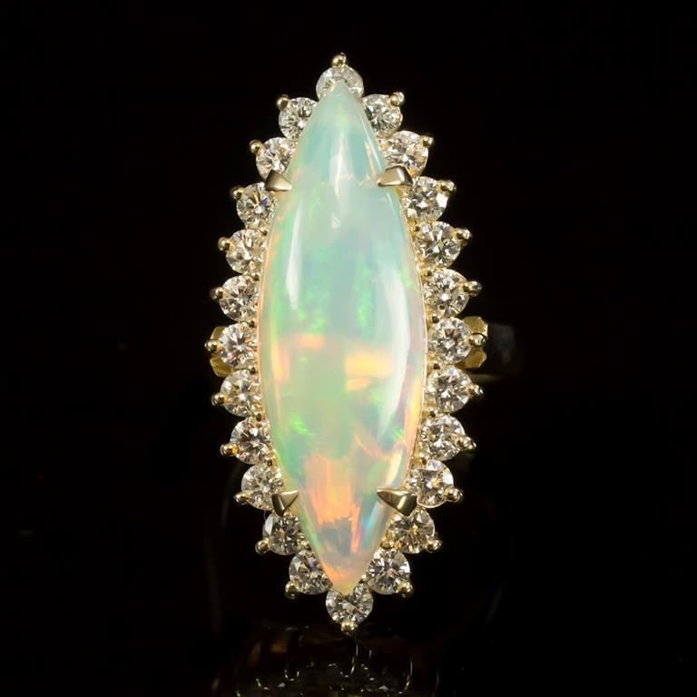 14K Gold 7.67ct Opal 1.95ct Diamond Ring: Retail: $13,785.00 ****** 14K Gold Opal & Diamond Ring ****** Metal: 14K Solid Yellow Gold / Total Item Weight: 12.2 grams / Country Made: United States / / Main Stone: Opal / Color: Play of Color / C