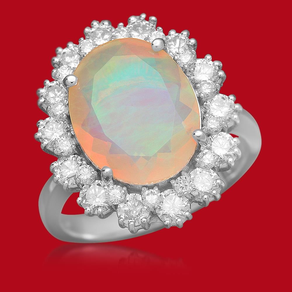 14K Gold 2.61ct Opal 1.32ct Diamond Ring: Retail: $5,977.00 ****** 14K Gold 2.61ct Opal 1.32ct Diamond Ring****** Metal: 14K Solid Gold / Total Item Weight: 5.6 grams / Country Made: United States / / Main Stone: Opal / Color: Play of Color /