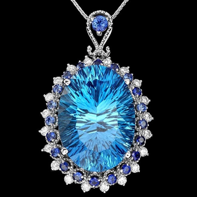 14k Gold 23ct Topaz 0.60ct Diamond Pendant: Retail: $9,855.00 ****** 14k Gold 23ct Topaz 0.60ct Diamond Pendant ****** Metal: 14k Solid White Gold / Size: 7 / Total Item Weight: 9.5 grams / Country Made: United States / / Main Stone: Topaz / Co