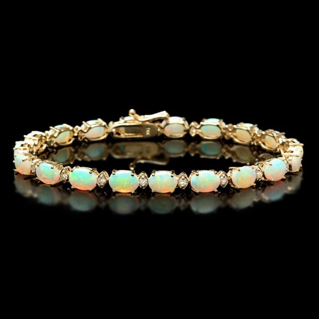 14k Gold 8.20ct Opal 0.70ct Diamond Bracelet: Retail: $11,350.00 ****** 14k Gold 8.20ct Opal 0.70ct Diamond Bracelet ****** Metal: 14k Solid Yellow Gold / Size: 7.25 / Total Item Weight: 10.0 grams / Country Made: United States / / Main Stone: Op