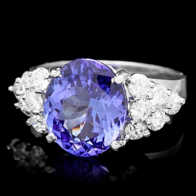 14k Gold 5.00ct Tanzanite 0.90ct Diamond Ring: Retail: $13,750.00******14k Gold 5.00ct Tanzanite 0.90ct Diamond Ring ****** Metal: 14k Solid White Gold / Size: 7 / Total Item Weight: 5.0 grams / Country Made: USA / / Main Stone: Tanzanite / Color: