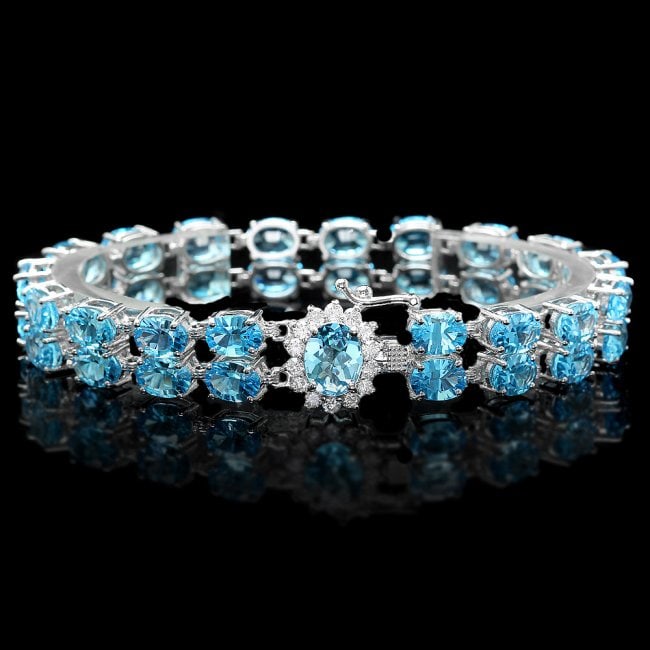 14k Gold 33.5ct Topaz 0.66ct Diamond Bracelet: Retail: $15,840.00*******14k Gold 33.5ct Topaz 0.66ct Diamond Bracelet ****** Metal: 14k Solid White Gold / Size: 7 / Total Item Weight: 24.0 grams / Country Made: USA / / Main Stone: Topaz / Color: B