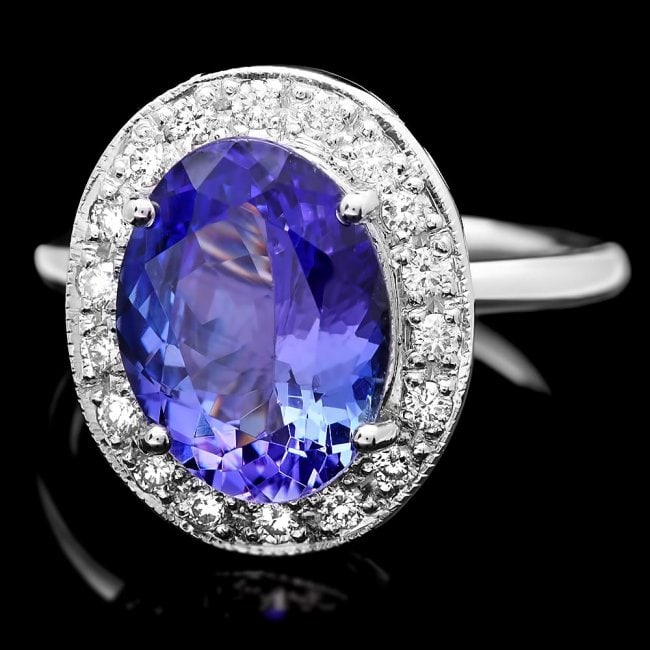 14k Gold 4.00ct Tanzanite 0.35ct Diamond Ring: Retail: $10,300.00 ****** 14k Gold 4.00ct Tanzanite 0.35ct Diamond Ring ****** Metal: 14k Solid White Gold / Size: 7.5 / Total Item Weight: 6.5 grams / Country Made: United States / / Main Stone: Tanz