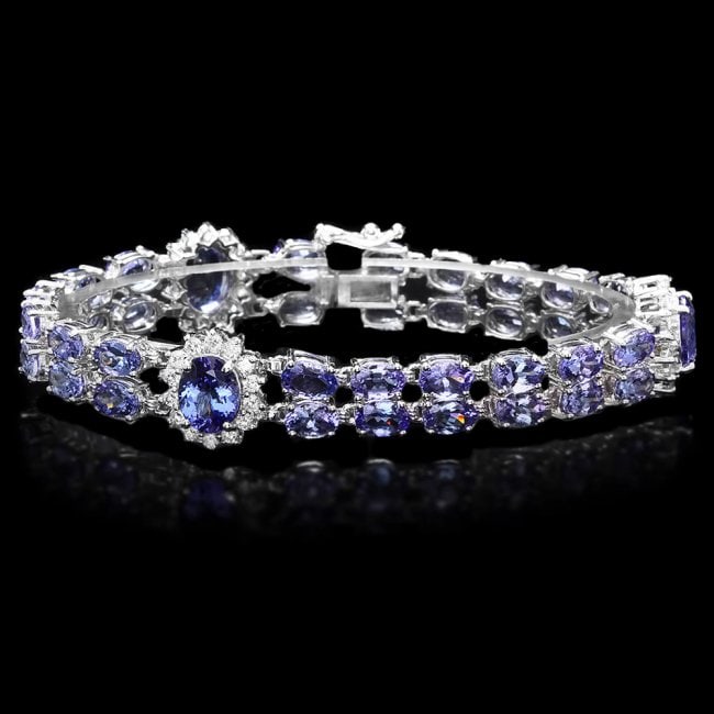 14k Gold 22ct Tanzanite 1.50ct Diamond Bracelet: Retail: $21,300.00 ****** 14k Gold 22ct Tanzanite 1.50ct Diamond Bracelet ****** Metal: 14k Solid White Gold / Size: 7 / Total Item Weight: 20 grams / Country Made: United States / / Main Stone: Tanza