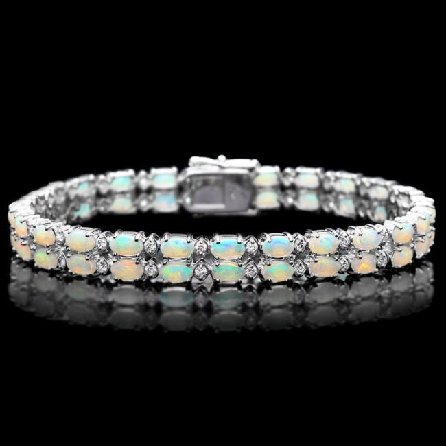 14k Gold 6.50ct Opal 1.20ct Diamond Bracelet: Retail: $13,890.00 ****** 14k Gold 6.50ct Opal 1.20ct Diamond Bracelet ****** Metal: 14k Solid White Gold / Size: 7 / Total Item Weight: 18.0 grams / Country Made: United States / / Main Stone: Opal /