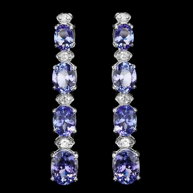 14k Gold 9.00ct Tanzanite 0.50ct Diamond Earrings: Retail: $7,500.00 ****** 14k Gold 9.00ct Tanzanite 0.50ct Diamond Earrings ****** Metal: 14k Solid White Gold / Total Item Weight: 7.5 grams / Country Made: United States / / Main Stone: Tanzanite / C