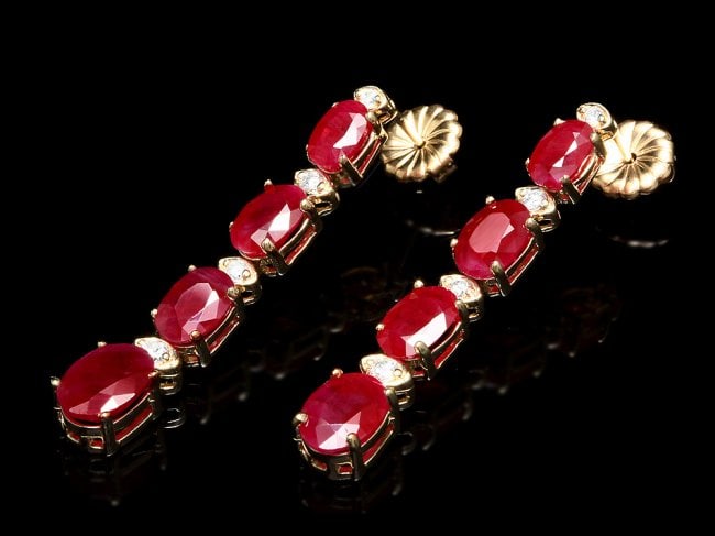14k Gold 8.50ct Ruby 0.25ct Diamond Earrings: Retail: $6,500.00 ****** 14k Gold 8.50ct Ruby 0.25ct Diamond Earrings ****** Metal: 14k Solid Yellow Gold / Total Item Weight: 5.5 grams / Country Made: United States / / Main Stone: Ruby / Color: Red