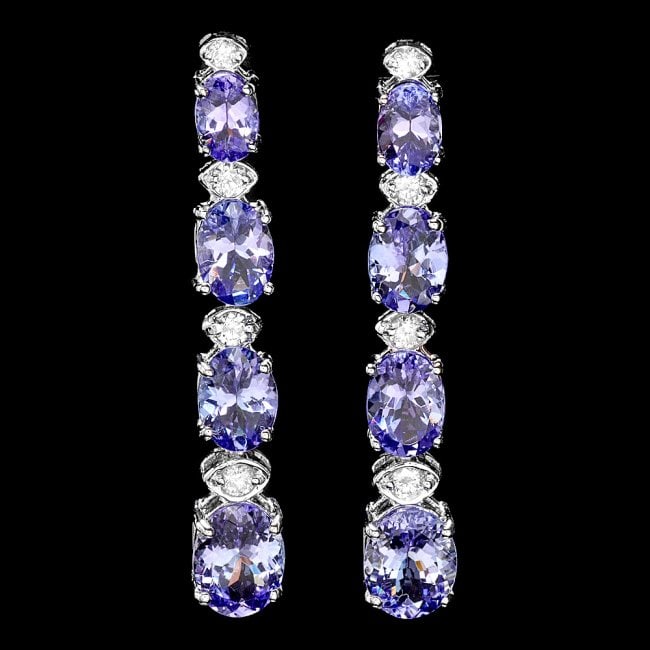 14k Gold 7ct Tanzanite 0.45ct Diamond Earrings: Retail: $8,850.00 ****** 14k Gold 7ct Tanzanite 0.45ct Diamond Earrings ****** Metal: 14k Solid White Gold / Total Item Weight: 5.0 grams / Country Made: United States / / Main Stone: Tanzanite / Colo