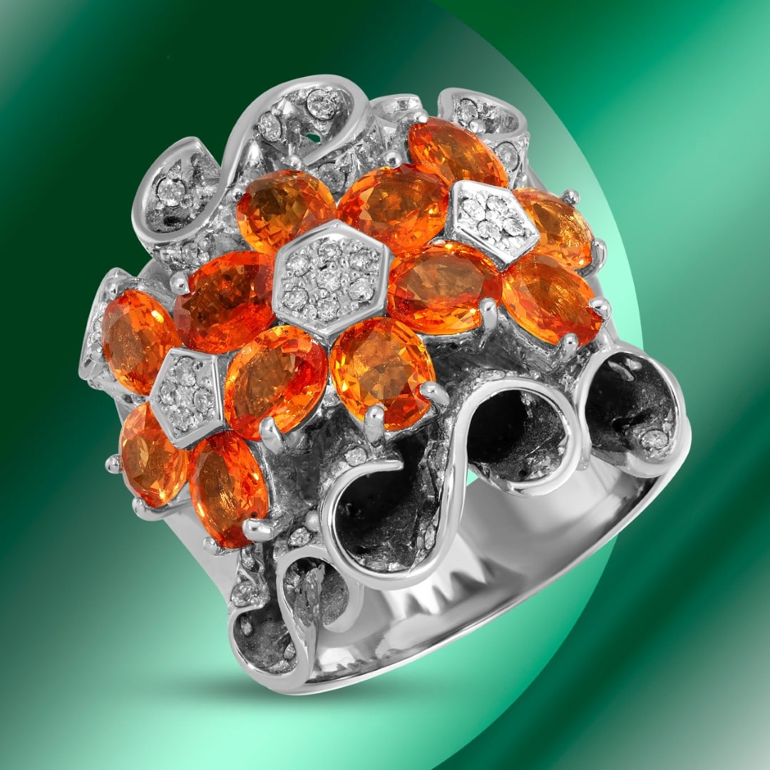 4.38cts Orange Sapphire & 0.31cts Diamond Ring: Retail: $17,395*****Orange Sapphire & Diamond Ring*****Metal: 14K White Gold/ Total Wt.: 17.6g / Country Made US// Main Stone: Sapphire / Carat Total Wt.: 4.38cts / Treatment: none / Color: Orange /