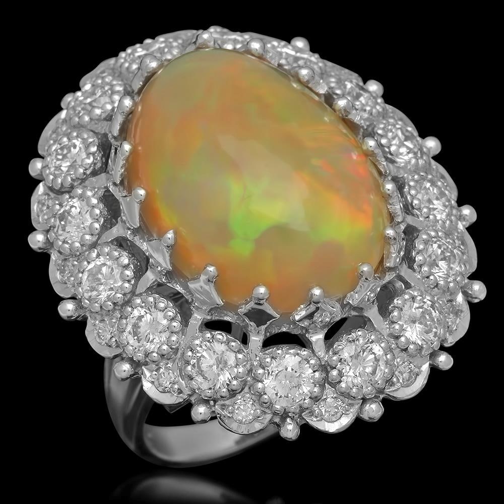 14K Gold 11.64ct Opal 2.89ct Diamond Ring: Retail: $19,788.00 ****** 14K Gold 11.64ct Opal 2.89ct Diamond Ring ****** Metal: 14K Solid Gold / Total Item Weight: 16.4 grams / Country Made: United States / / Main Stone: Opal / Color: Play of col