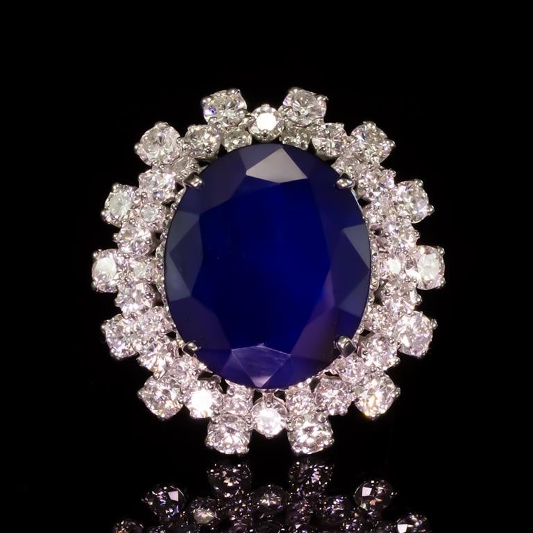 14K Gold 12.29ct Sapphire 3.85ct Diamond Ring: Retail: $15,240.00 ****** 14K Gold Sapphire & Diamond Ring ****** Metal: 14K Solid White Gold / Total Item Weight: 14.0 grams / Country Made: United States / / Main Stone: Sapphire / Color: Blue / Car