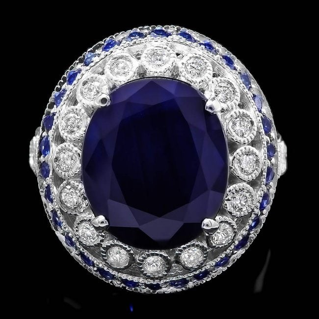 14k Gold 9.35ct Sapphire 0.55ct Diamond Ring: Retail: $8,750.00 ****** 14k Gold 9.35ct Sapphire 0.55ct Diamond Ring ****** Metal: 14k Solid White Gold / Size: 7.5 / Total Item Weight: 9.0 grams / Country Made: United States / / Main Stone: Sapphi