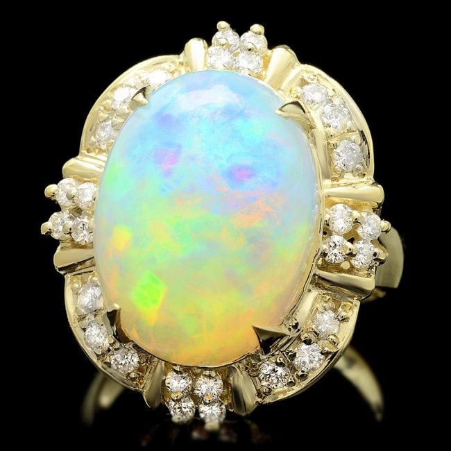 14k Yellow Gold 11.00ct Opal 0.70ct Diamond Ring: Retail: $14,300.00 ****** 14k Yellow Gold 11.00ct Opal 0.70ct Diamond Ring ****** Metal: 14k Solid Yellow Gold / Size: 7 / Total Item Weight: 11.0 grams / Country Made: United States / / Main Stone: O