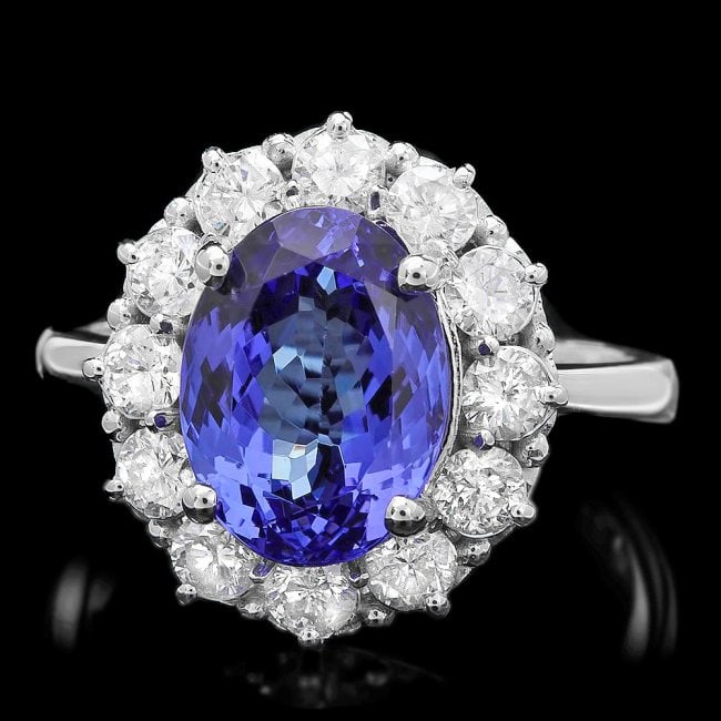 14k Gold 4.50ct Tanzanite 1.10ct Diamond Ring: Retail: $12,300.00 ****** 14k Gold 4.50ct Tanzanite 1.10ct Diamond Ring ****** Metal: 14k Solid White Gold / Size: 7.75 / Total Item Weight: 5.5 grams / Country Made: United States / / Main Stone: Tan