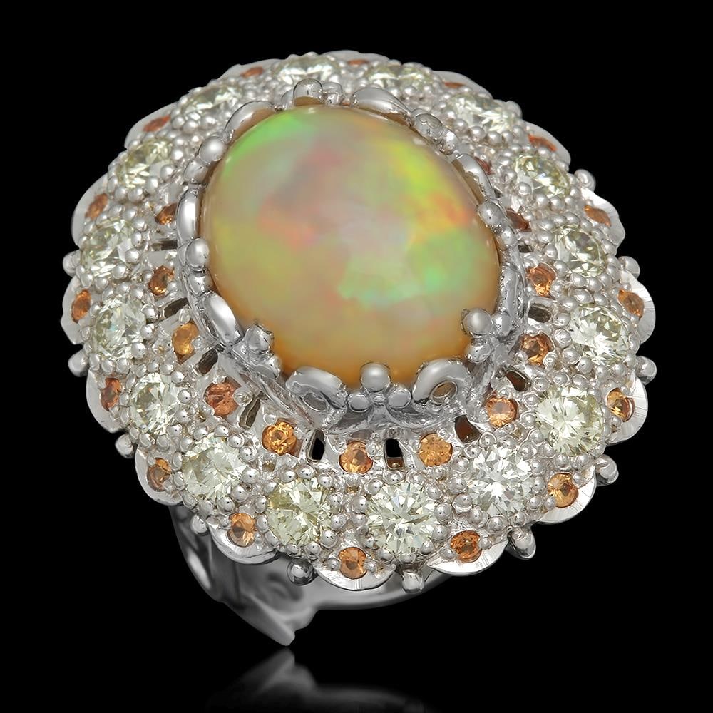 14K Gold 7.12ct Opal 0.48ct Sapphire 2.20ct Diamond Ring: Retail: $13,452.00 ****** 14K Gold 7.12ct Opal 0.48ct Orange Sapphire 2.20ct Diamond Ring ****** Metal: 14K Solid Gold / Total Item Weight: 12.8 grams / Country Made: United States / / Main Stone: Opa