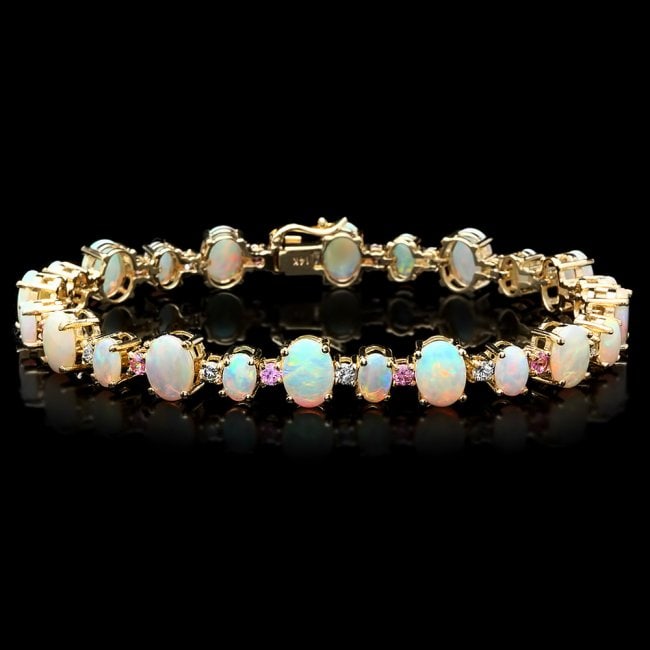 14k Gold 12.00ct Opal 0.85ct Diamond Bracelet: Retail: $14,500.00 ****** 14k Gold 12.00ct Opal 0.85ct Diamond Bracelet ****** Metal: 14k Solid Yellow Gold / Size: 7.5 / Total Item Weight: 18 grams / Country Made: United States / / Main Stone: Opal