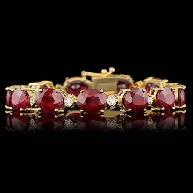14k Gold 46.50ct Ruby 0.90ct Diamond Bracelet: Retail: $24,400.00 ****** 14k Gold 46.50ct Ruby 0.90ct Diamond Bracelet ****** Metal: 14k Solid Yellow Gold / Size: 7 / Total Item Weight: 26.0 grams / Country Made: United States / / Main Stone: Ruby