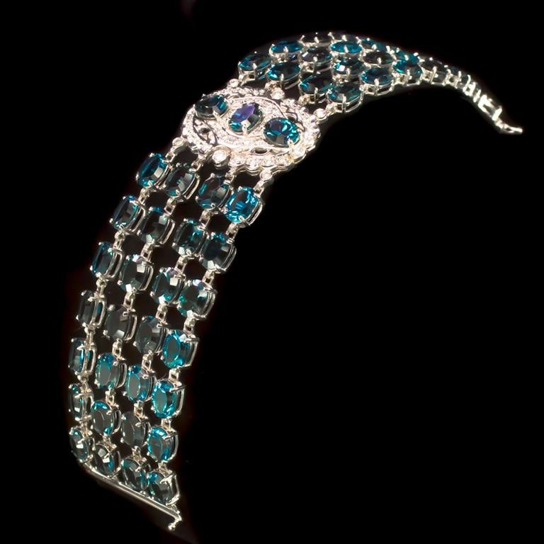 14K Gold 87.98ct Blue Topaz 1.05ct Diamond Bracelet: Retail: $25,938.00******Blue Topaz & Diamond Bracelet ****** Metal: 14k Solid White Gold / Total Item Weight: 52.2 grams / Country Made: United States / / Main Stone: Blue Topaz / Color: Dark Blue