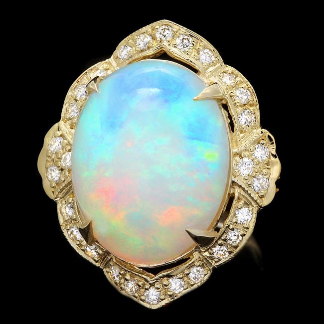 14k Yellow Gold 14.00ct Opal 0.70ct Diamond Ring: Retail: $12,700.00 ****** 14k Yellow Gold 14.00ct Opal 0.70ct Diamond Ring ****** Metal: 14k Solid Yellow Gold / Size: 7 / Total Item Weight: 10.0 grams / Country Made: United States / / Main Stone: O