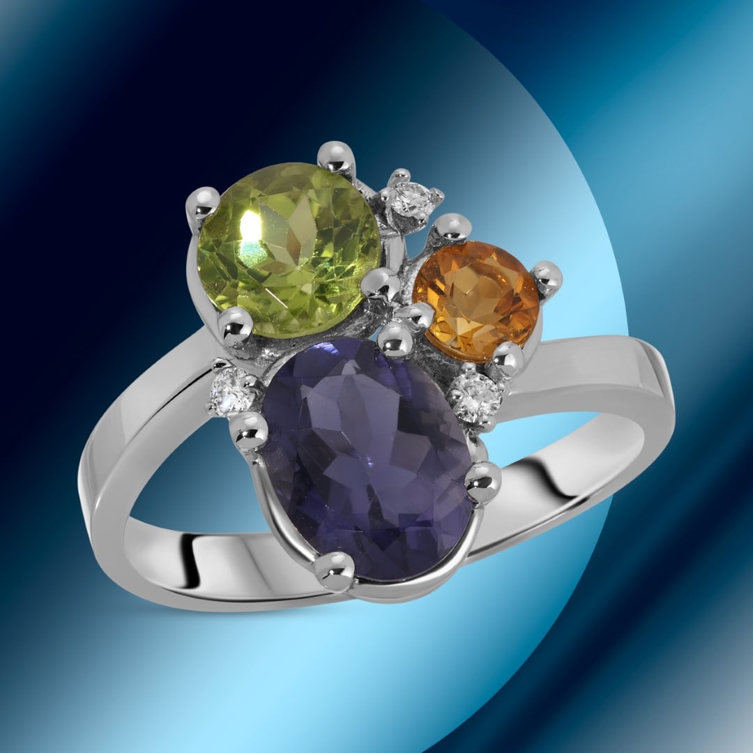 14K Gold 1.20cts Tanzanite, 0.76cts Peridot, 0.30cts Citrine & 0.05cts Diamond Ring: Retail: $3,860*****14K Gold Tanzanite, Peridot, Citrine & Diamond Ring*****Metal: 14K White Gold/ Total Wt.:4.1g / Country Made US// Primary Stone: Tanzanite, 1.20 cts, Secondary Stone: Peridot, 0.76
