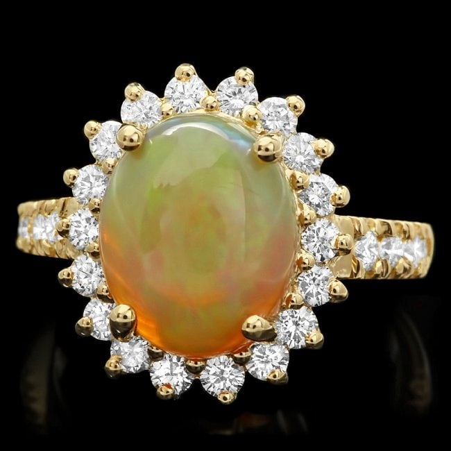 14k Yellow Gold 3ct Opal 1ct Diamond Ring: Retail: $7,200.00 ****** 14k Yellow Gold 3ct Opal 1ct Diamond Ring ****** Metal: 14k Solid Yellow Gold / Size: 7.5 / Total Item Weight: 6 grams / Country Made: United States / / Main Stone: Opal / Col