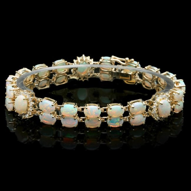 14k Gold 16.5ct Opal 1.10ct Diamond Bracelet: Retail: $17,400.00 ****** 14k Gold 16.5ct Opal 1.10ct Diamond Bracelet ****** Metal: 14k Solid Yellow Gold / Size: 7.5 / Total Item Weight: 21.0 grams / Country Made: United States / / Main Stone: Opa
