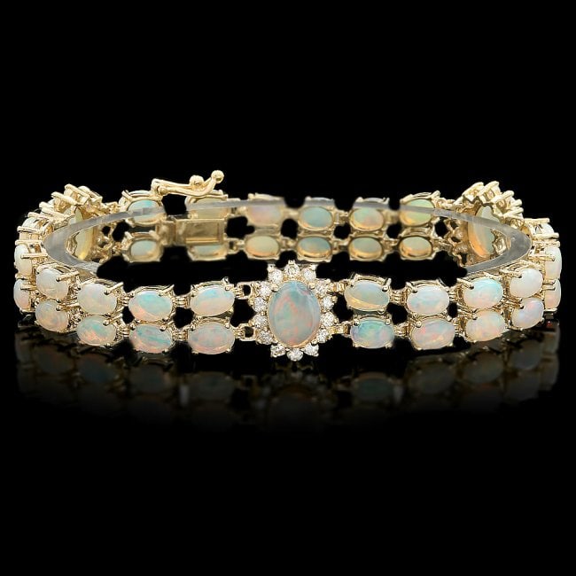 14k Yellow Gold 12ct Opal 1.35ct Diamond Bracelet: Retail: $15,600.00 ****** 14k Yellow Gold 12ct Opal 1.35ct Diamond Bracelet ****** Metal: 14k Solid Yellow Gold / Size: 7.5 / Total Item Weight: 18.5 grams / Country Made: United States / / Main Stone