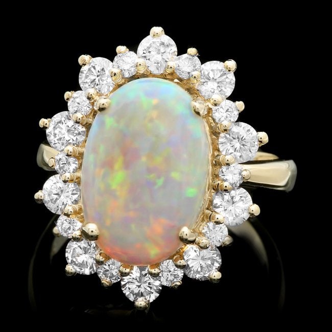 14k Yellow Gold 3.50ct Opal 1.60ct Diamond Ring: Retail: $8,500.00 ****** 14k Yellow Gold 3.50ct Opal 1.60ct Diamond Ring ****** Metal: 14k Solid Yellow Gold / Size: 7.75 / Total Item Weight: 6.5 grams / Country Made: United States / / Main Stone: O