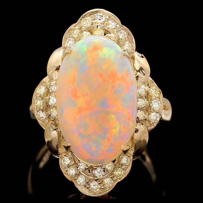 14k Yellow Gold 3.85ct Opal 0.50ct Diamond Ring: Retail: $7,500.00 ****** 14k Yellow Gold 3.85ct Opal 0.50ct Diamond Ring ****** Metal: 14k Solid Yellow Gold / Size: 6.75 / Total Item Weight: 7.0 grams / Country Made: United States / / Main Stone: O