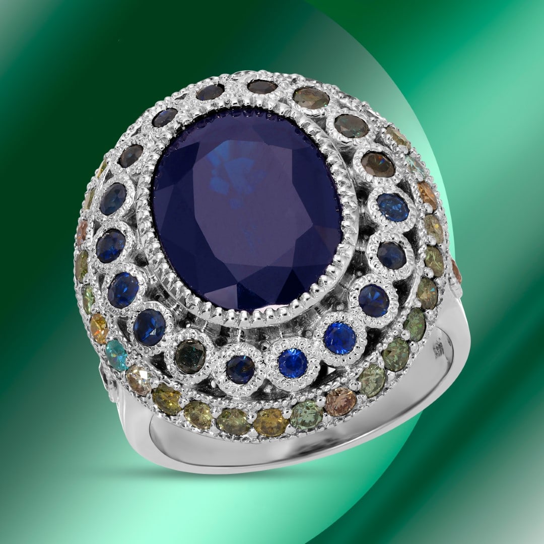 14k Gold 6.43ctc Sapphire & 1.01ctc Diamond Ring: Retail: $14,860*****14k Gold Sapphire & Diamond Ring*****Metal: 14K White Gold/ Total Wt.:11.0g / Country Made US// Main Stone: Sapphire / Carat Total Wt.: 6.43cts / Treatment: None / Color: Dark Blue