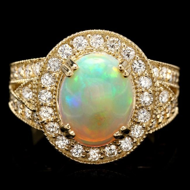 14K Gold 2.40ct Opal 1.20ct Diamond Ring: Retail: $8,500.00****** 14K Gold 2.40ct Opal 1.20ct Diamond Ring ****** Metal: 14k Solid White Gold / Total Item Weight: 9.0 grams / Country Made: United States / / Main Stone: Emerald / Color: Multi-