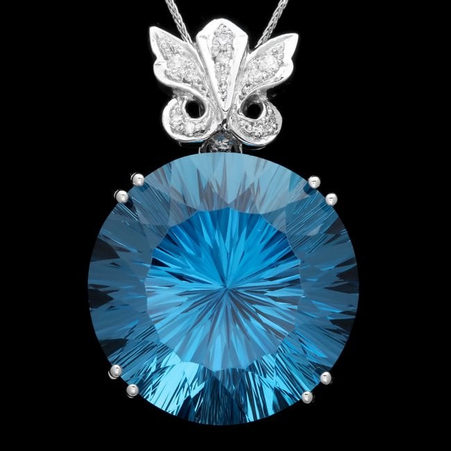 14k Gold 68.00ct Topaz 0.20ct Diamond Pendant: Retail: $12,000.00 ****** 14k Gold 68.00ct Topaz 0.20ct Diamond Pendant ****** Metal: 14k Solid White Gold / Size: 16 / Total Item Weight: 23.0 grams / Country Made: United States / / Main Stone: Topa