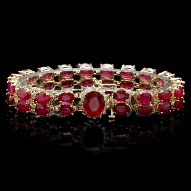 14k Yellow Gold 50ct Ruby 0.75ct Diamond Bracelet: Retail: $21,300.00 ****** 14k Yellow Gold 50ct Ruby 0.75ct Diamond Bracelet ****** Metal: 14k Solid Yellow Gold / Size: 7 / Total Item Weight: 27.0 grams / / Main Stone: Ruby / Color: Red / Carat Tota