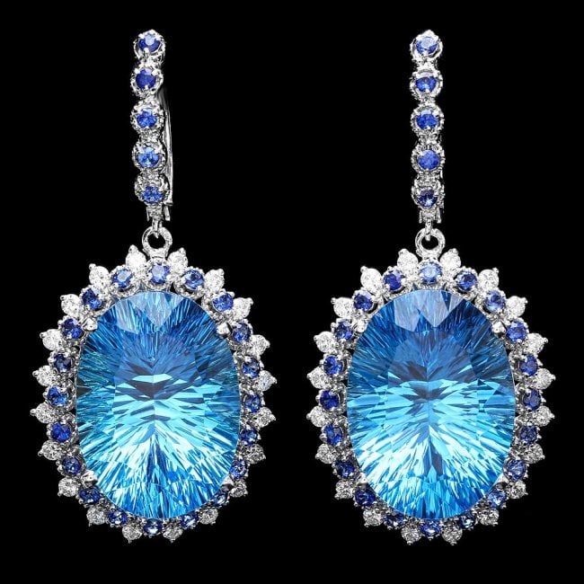 14k Gold 45ct Topaz 1.20ct Diamond Earrings: MSRP: $19,820.00******14k Gold 45ct Topaz 1.20ct Diamond Earrings ****** Metal: 14k Solid White Gold / Total Item Weight: 20.0 grams / Country Made: USA / / Main Stone: Topaz / Color: Blue / Carat