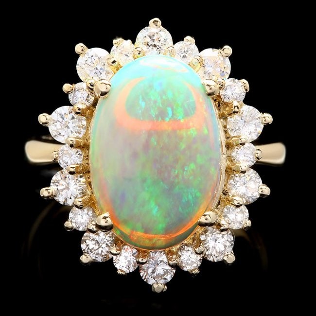 14k Yellow Gold 3.00ct Opal 1.30ct Diamond Ring: Retail: $9,300.00 ****** 14k Yellow Gold 3.00ct Opal 1.30ct Diamond Ring ****** Metal: 14k Solid Yellow Gold / Size: 7.25 / Total Item Weight: 7.0 grams / Country Made: United States / / Main Stone: