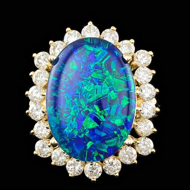 14k Yellow Gold 6.50ct Opal 1.50ct Diamond Ring: Retail: $13,600.00 ****** 14k Yellow Gold 6.50ct Opal 1.50ct Diamond Ring ****** Metal: 14k Solid Yellow Gold / Size: 6.75 / Total Item Weight: 7.7 grams / Country Made: United States / / Main Stone: 
