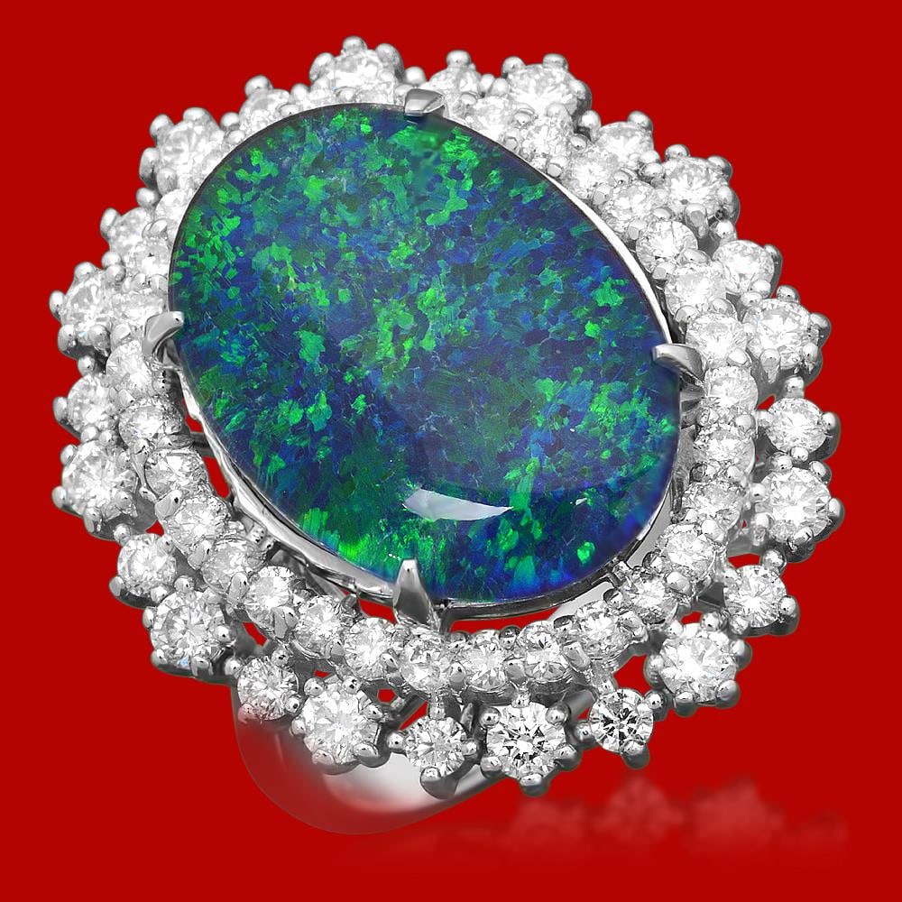 14k Gold 6.48ct Opal 1.76ct Diamond Ring: Retail: $7,900.00 ****** 14K Gold 6.48ct Opal 1.76ct Diamond Ring ****** Metal: 14k Solid White Gold / Size: 7 / Total Item Weight: 6.48 grams / / Main Stone: Natural Opal / Color: Play Of Color / Car