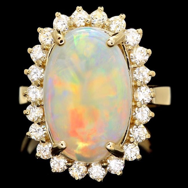 14k Yellow Gold 4.00ct Opal 1.00ct Diamond Ring: Retail: $8,900.00 ****** 14k Yellow Gold 4.00ct Opal 1.00ct Diamond Ring ****** Metal: 14k Solid Yellow Gold / Size: 6.75 / Total Item Weight: 7.0 grams / Country Made: United States / / Main Stone: O