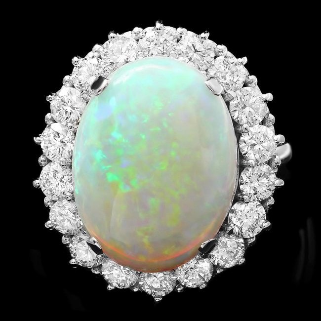 14k White Gold 9.00ct Opal 2.50ct Diamond Ring: Retail: $22,750.00 ****** 14k White Gold 9.00ct Opal 2.50ct Diamond Ring ****** Metal: 14k Solid White Gold / Total Item Weight: 9 grams / Country Made: USA / / Main Stone: Opal / Color: White / Carat