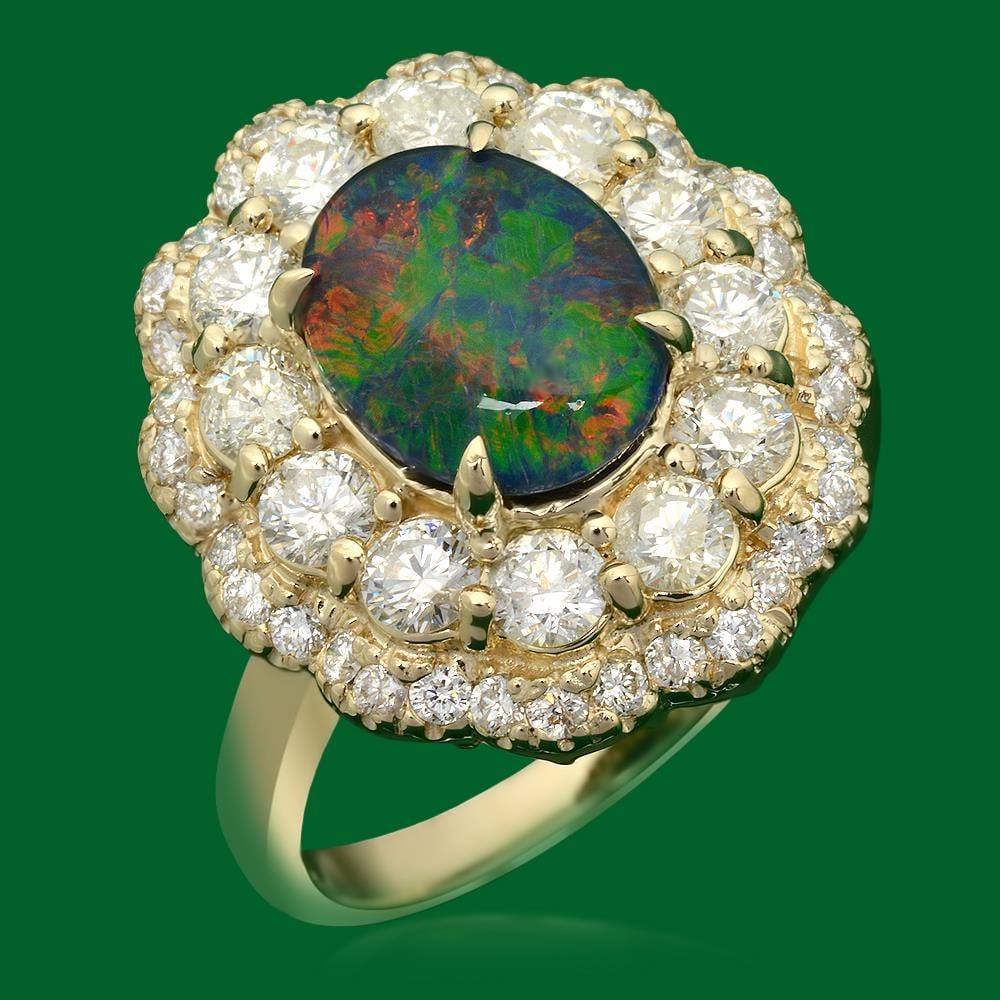 14k Gold 1.78ct Opal 1.72ct Diamond Ring: Retail: $6,325.00 ****** 14k Gold 1.78ct Opal 1.72ct Diamond Ring ****** Metal: 14k Solid Yellow Gold / Size: 7 / Total Item Weight: 1.78 grams / Country Made: United States / / Main Stone: Opal / Col