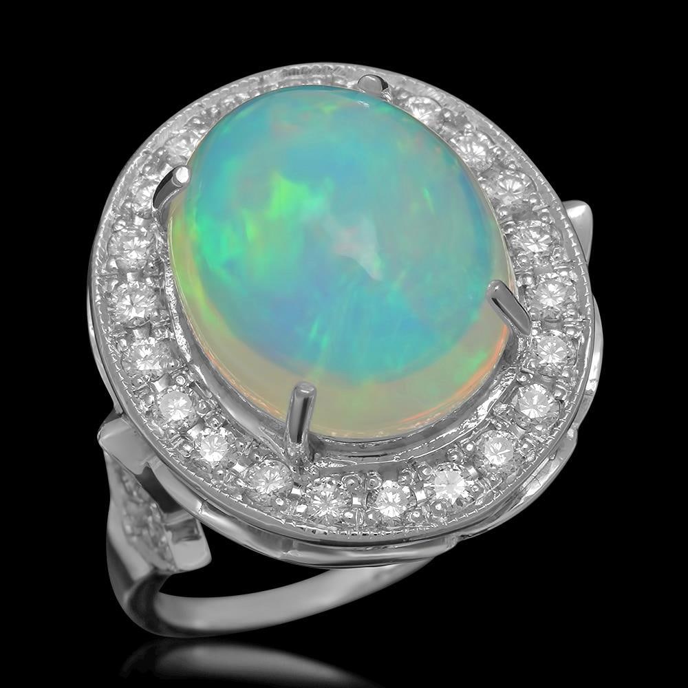 14K Gold 5.67ct Opal 0.88ct Diamond Ring: Retail: $8,768.00 ****** 14K Gold 5.67ct Opal 0.88ct Diamond Ring ****** Metal: 14K Solid Gold / Total Item Weight: 8.4 grams / Country Made: United States / / Main Stone: Opal / Color: Play of color 
