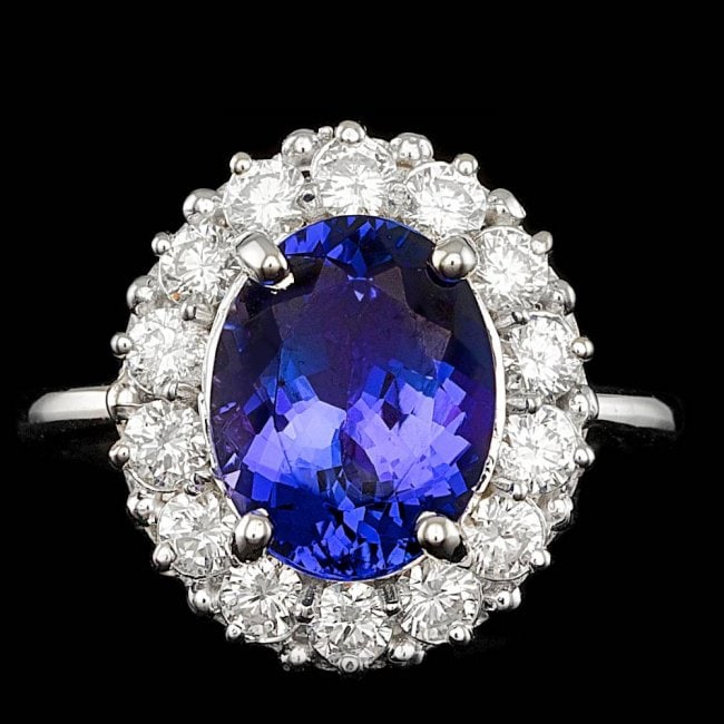 14k Gold 4.00 Ct Tanzanite 1.00ct Diamond Ring: Retail: $9,800.00 ****** 14k Gold 4.00 Ct Tanzanite 1.00ct Diamond Ring ****** Metal: 14k Solid White Gold / Size: 7.25 / Total Item Weight: 5.5 grams / Country Made: United States / / Main Stone: Tan