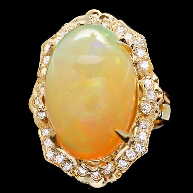 14k Yellow Gold 17.00ct Opal 0.65ct Diamond Ring: Retail: $17,500.00 ****** 14k Yellow Gold 17.00ct Opal 0.65ct Diamond Ring ****** Metal: 14k Solid Yellow Gold / Size: 7.25 / Total Item Weight: 12.5 grams / Country Made: United States / / Main Stone