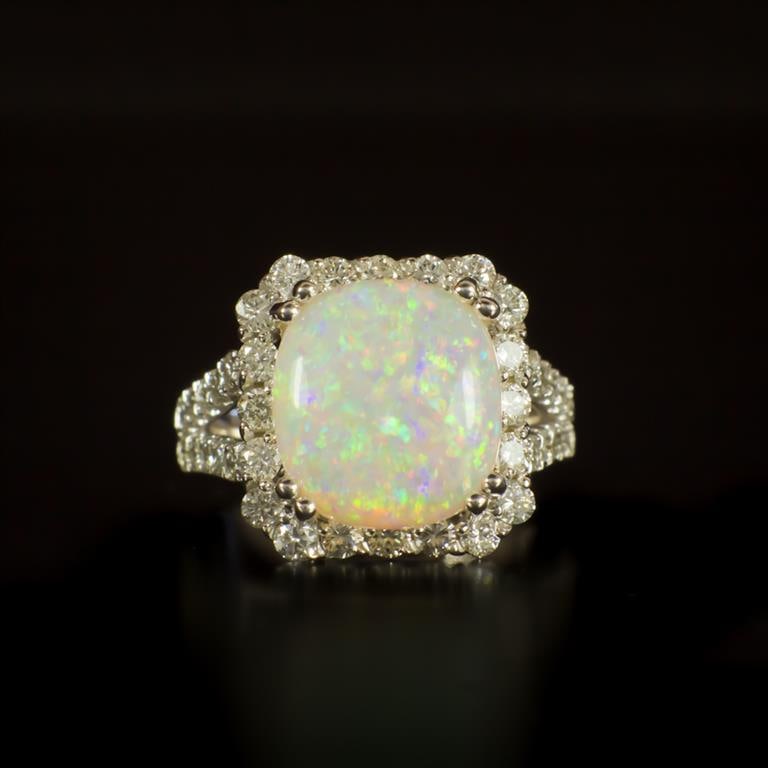 14K Gold 5.31ct Opal 1.60ct Diamond Ring: Retail: $10,320.00 ****** 14K Gold Opal & Diamond Ring ****** Metal: 14K Solid White Gold / Total Item Weight: 8.6 grams / Country Made: United States / / Main Stone: Opal / Color: Play of Color / Car