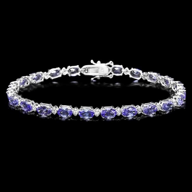 14k Gold 10ct Tanzanite 0.60ct Diamond Bracelet: Retail: $8,500.00 ****** 14k Gold 10ct Tanzanite 0.60ct Diamond Bracelet ****** Metal: 14k Solid White Gold / Size: 7 / Total Item Weight: 8.5 grams / Country Made: United States / / Main Stone: Tanza